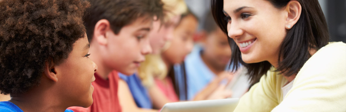 Smiling Woman talking to students