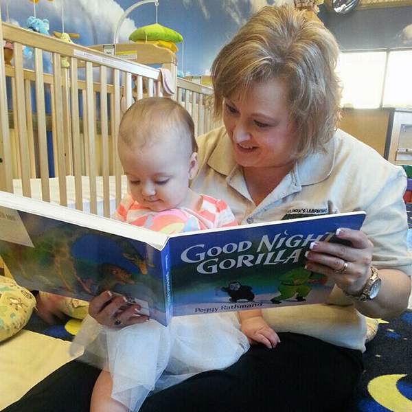 Woman reading to infant