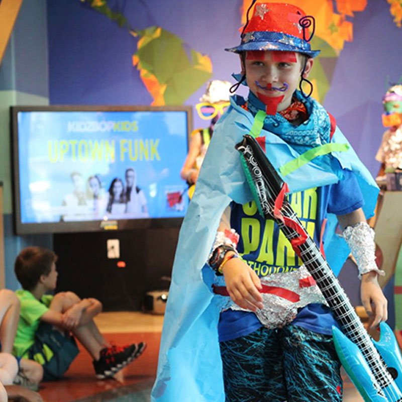 Young boy playing as a rock star